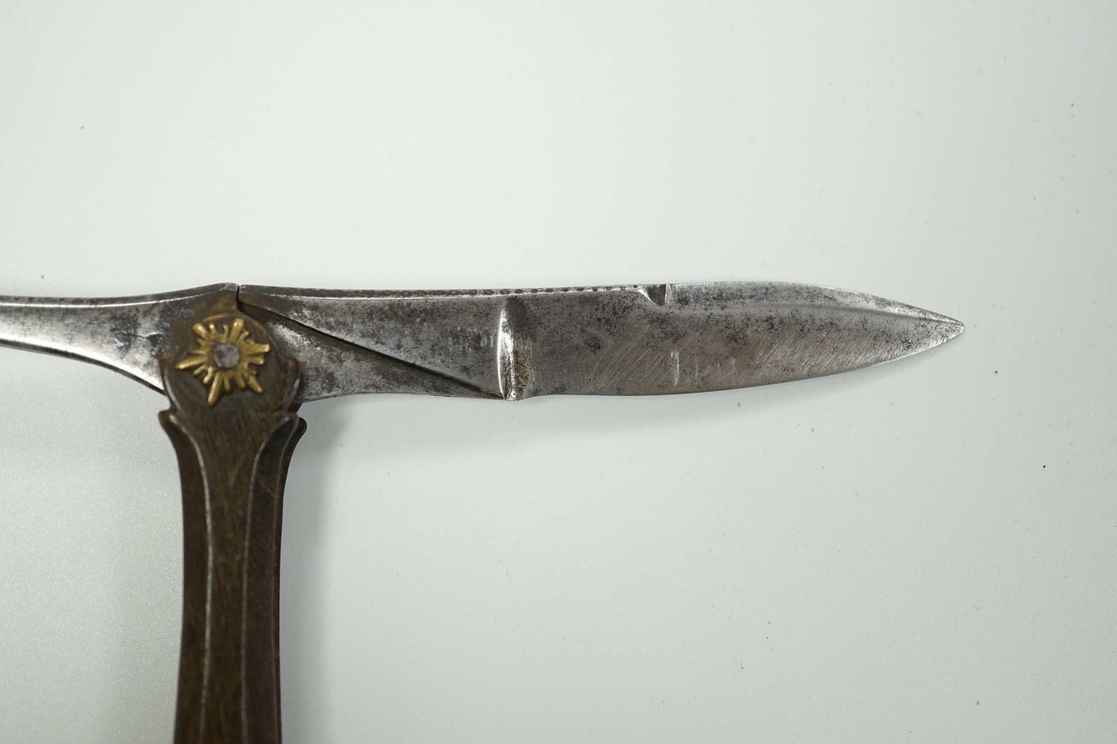 An early 19th century Continental brass, horn and steel folding pocket knife with ‘elephant’ seal to base, 11cm when closed